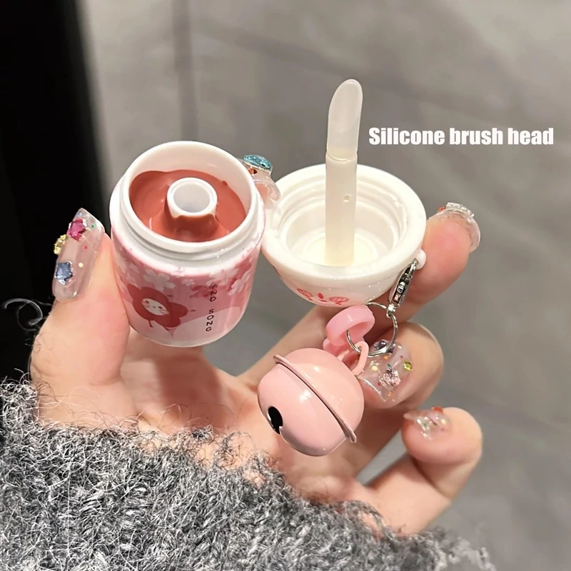 رژلب خامه ای تراول ماگ مدل زنگوله دار جا سوئیچی وارداتی